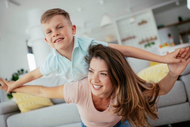 istock Mom and son having fun at home 1252271424