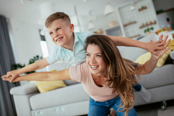 istock Mom and son having fun at home 1252271425