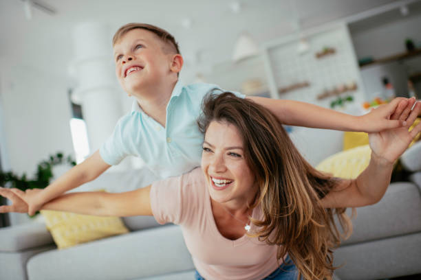 istock Mom and son having fun at home 1252271439