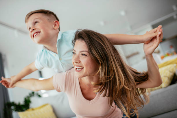 istock Mom and son having fun at home 1252271440