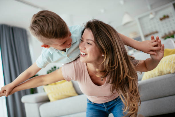 istock Mom and son having fun at home 1252271458