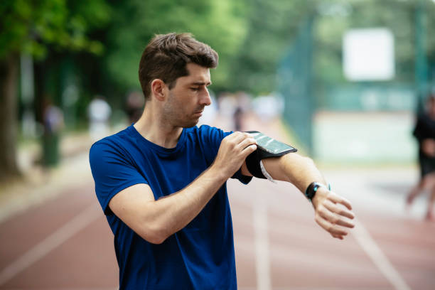 istock Young man checking his heart rate during work out. 1252271590