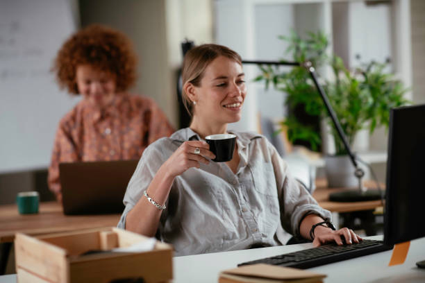 istock Businesswoman working and drinking coffee in office. 1252272666