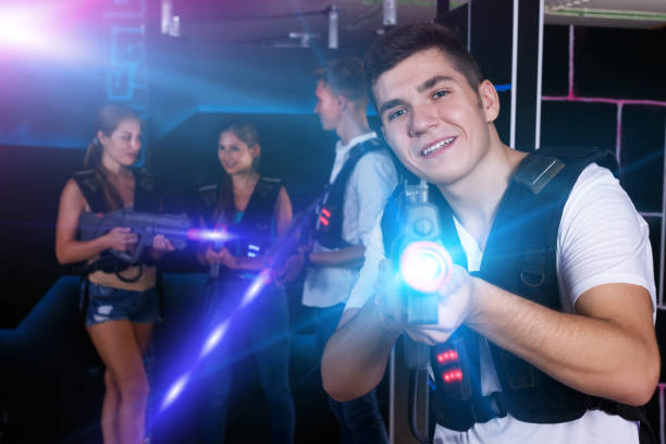 istock guy holding laser pistol playing laser tag game 1252279530
