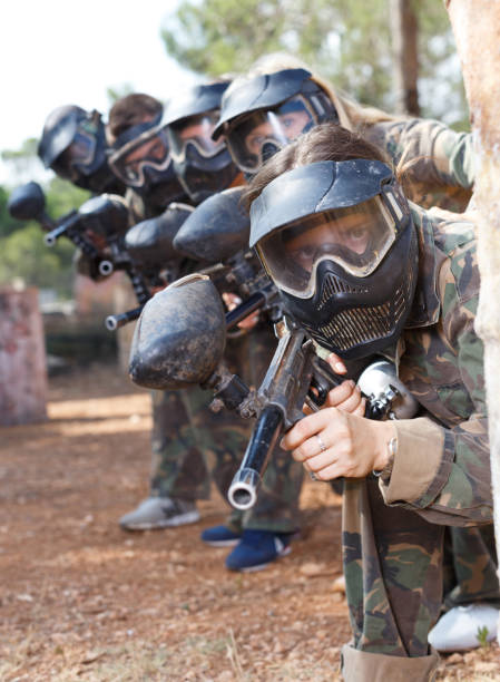 istock Paintball players aiming with guns 1252279992