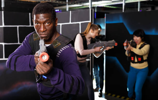 istock African man playing laser tag with friends 1252284226