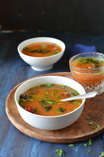 Indian style tomato and lentil soup/ broth / rasam