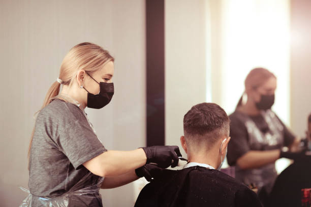 istock A hairdresser with security measures for Covid-19 1252286623