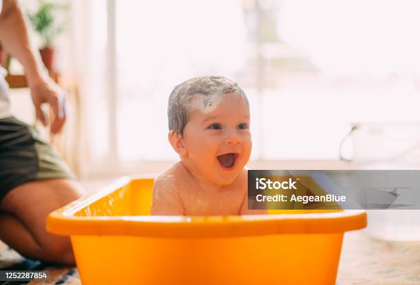 Cute Baby Playing In A Bathtub Stock Photo - Download Image Now - Baby - Human Age, Bathtub, Shower