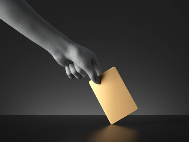 istock 3d render, mannequin hand holding blank golden card or ticket isolated on black background. Payment or voting metaphor. Modern minimal mockup with copy space. Concrete sculpture. Artificial human limb 1252288010