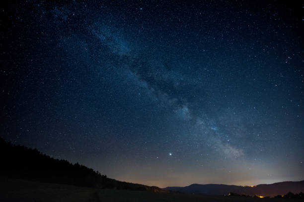 istock Milky way galaxy over small bavarian village 1252290783