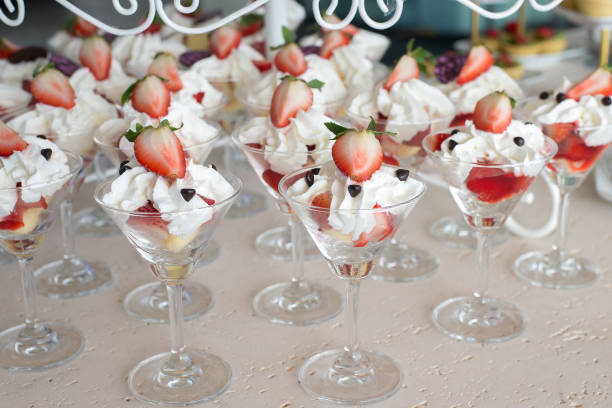 istock Strawberries with whipped cream glass in a row 1252295270