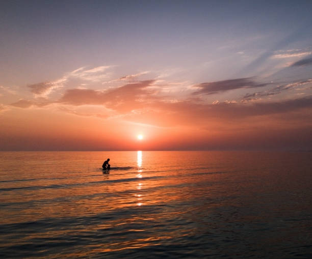 istock people in sunrise beach 1252295834