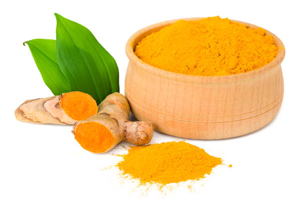 istock Turmeric powder with turmeric root isolated on white background 1252296631