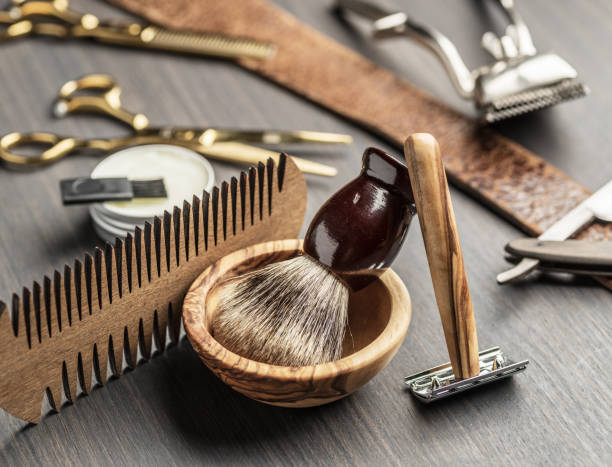 istock Classic grooming and hairdressing tools on wooden background. 1252299127