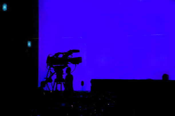 istock The silhouette camcorder (vdo camera) over blue screen 1252299754
