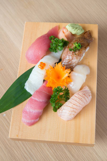 istock Nigiri sushi set on wooden plate 1252303433