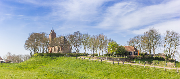 Panorama of the church on top of a mound in Hegebeintum, Netherlands