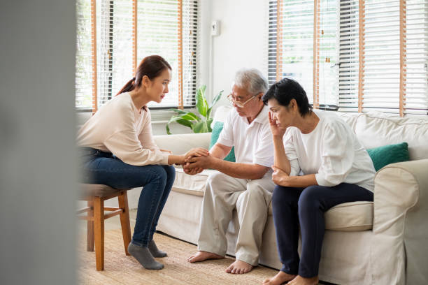 Caregiver psychologist console Asian senior people for mental health Caregiver psychologist console Asian senior people for mental health nervous holding hands stock pictures, royalty-free photos & images