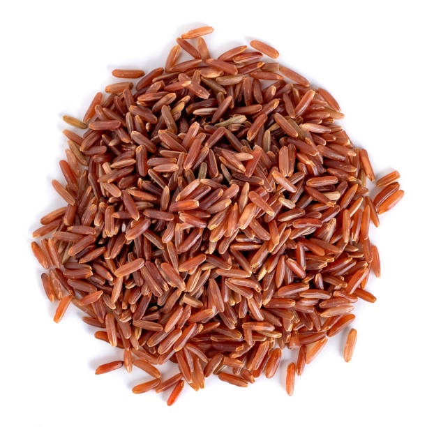 istock Heap of red rice isolated on white background, top view 1252305288