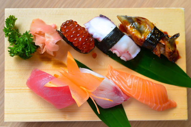 istock Sushi set on wooden plate 1252310967
