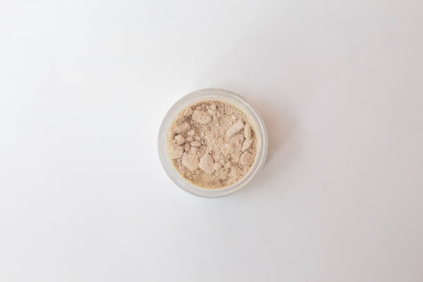 istock Blusher, eyeshadow and transparent face powder on white background with copy space, close-up. 1252315965