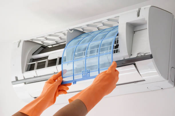istock Asian man hand hold air conditioner filter cleaning concept 1252316286
