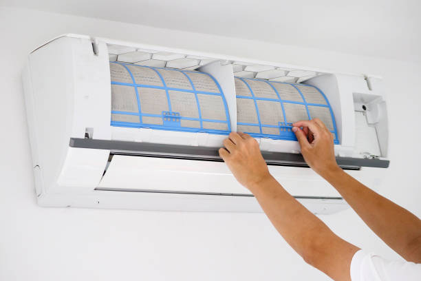 istock Asian man cleaning air conditioner dirty filter 1252316288