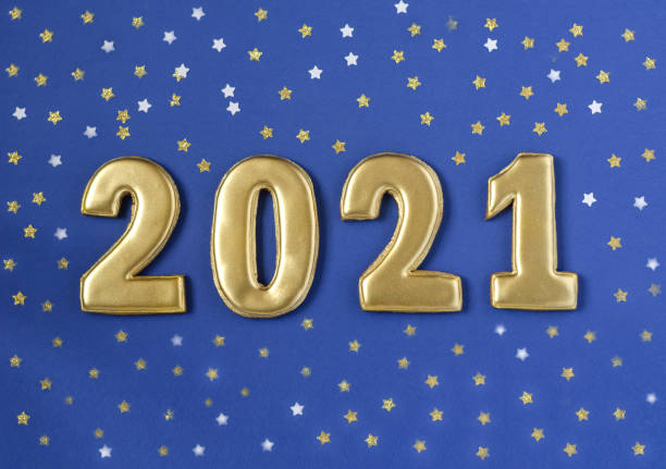 istock Gold numbers 2021 year lie on a blue background. 1252316357