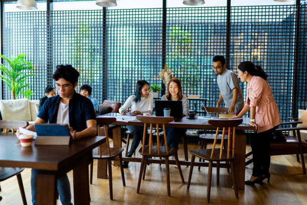 istock Asians Millennials working in busy coworking space 1252316645