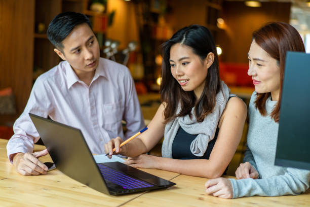 istock Asians Millennials discussing work in coworking space. 1252316830