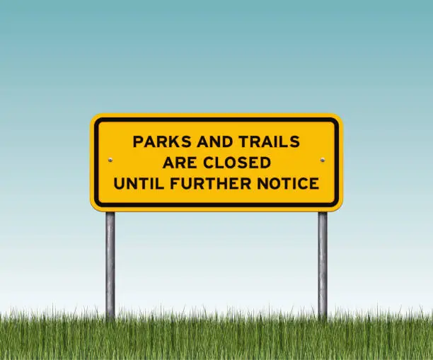 Vector illustration of Yellow 'park and trails closed' warning sign with grass
