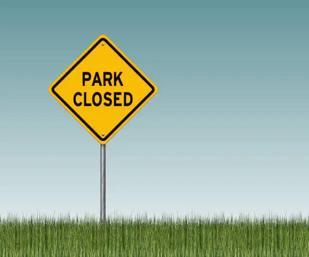 Vector illustration of Yellow park closed warning sign with grass