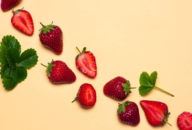 istock Fresh and ripe strawberry fruit on yellow background 1252318305