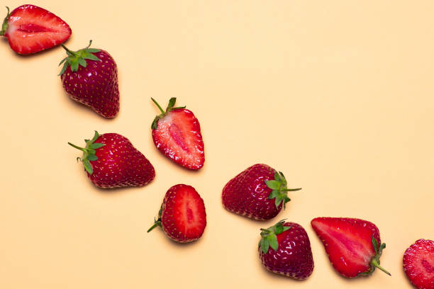 istock Fresh and ripe strawberry fruit on yellow background 1252318327