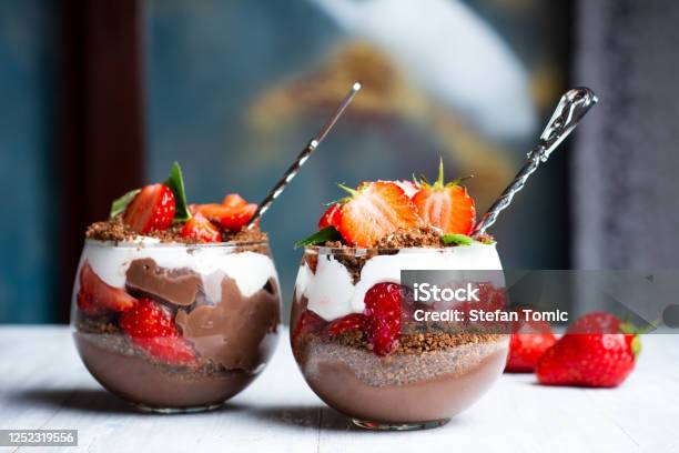 Strawberry Parfait Dessert In A Glass Cup With Cream And Chocola Stock Photo - Download Image Now