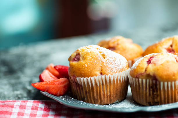 istock Homemade strawberry muffins on a baking paper 1252320448