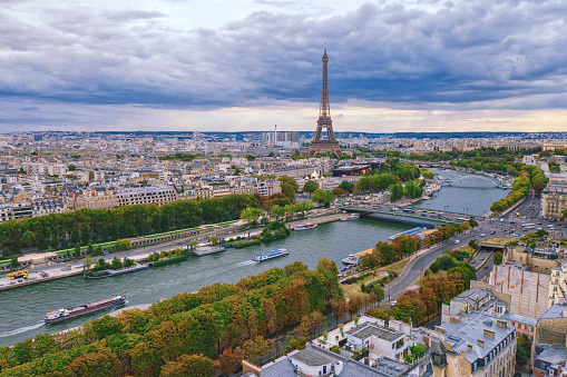 Aerial view of Paris with Seine river and Eiffel tower in the evening