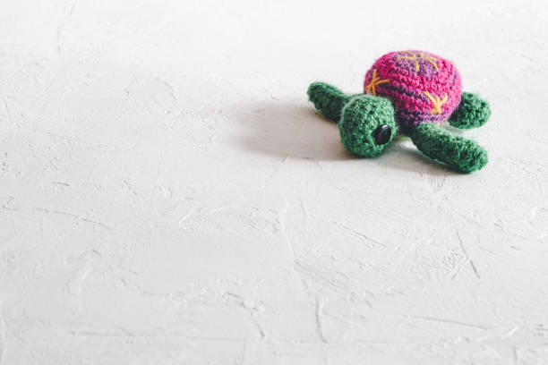 istock Handmade crochet turtle on a white background. 1252327839