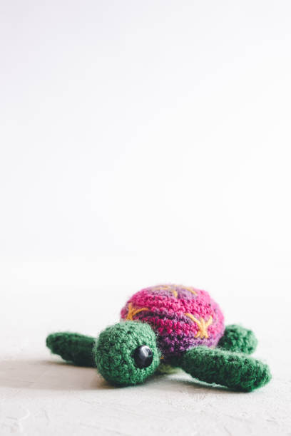 istock Handmade crochet turtle on a white background. 1252327864