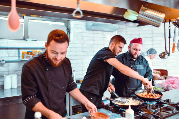 istock Kitchen Team Working Together To Achieve The Best Dishes 1252332292