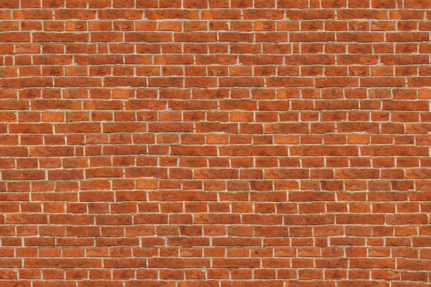 istock brick red wall. background of a old brick house. 1252333723
