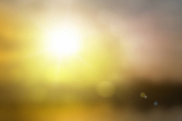 istock Natural background blurring warm colors and bright sun light. Bokeh or Christmas background Green Energy at sky sunny color orange light patterns plain abstract flare evening clouds blur. 1252333931