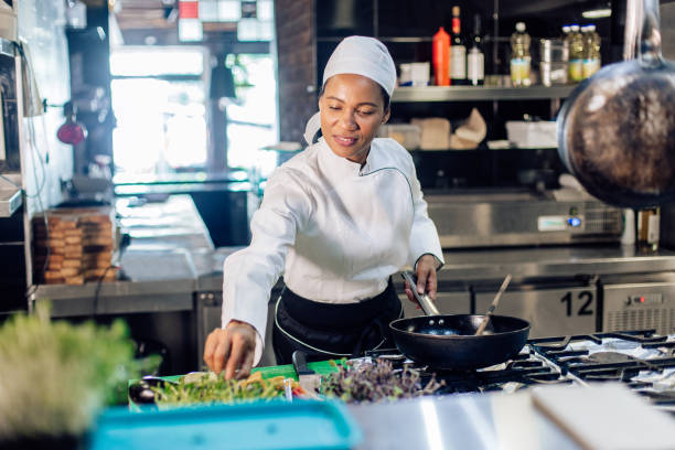 istock Female chef cooking fine dishes at the restaurant 1252338127