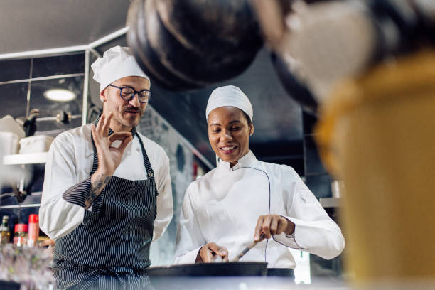 istock Chef is satisfied with the cooking of his trainee 1252338672