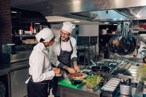 istock Chef is working on cooking training with his new employee 1252338679