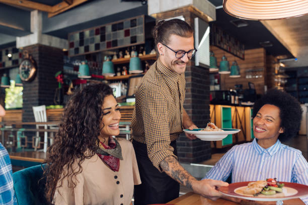 istock Group of colleagues getting their order at the restaurant 1252339701