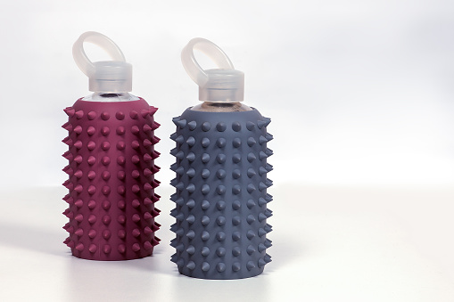 Two Reusable Glass Bottles For Water In Dusty Pink And Gray Rubber