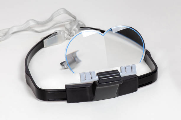 istock Special protective glasses wearing on forehead with folding lenses, for modelling hobby or painting works with little details. Part of assembled plane model. 1252350180