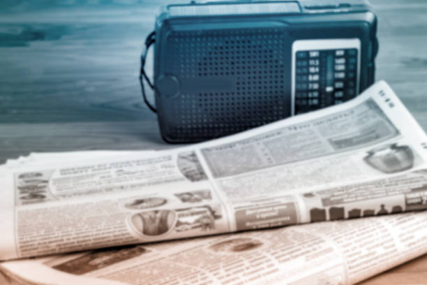 radio and newspapers on the office desk, media breaking news concept.soft focus. - newspaper the media paper newspaper headline imagens e fotografias de stock